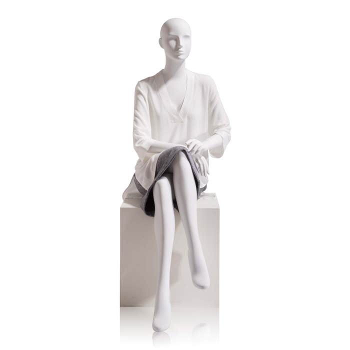 Econoco Female-Abstract Head Facing Straight, Seated, Right Leg Over Left, Hands in Lap