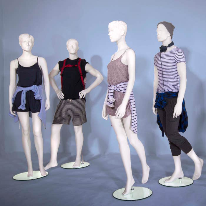 Econoco Male Mannequin - Molded Head, Arms by Side, Left Leg Slightly Bent