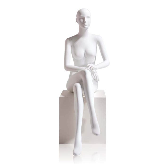 Econoco Female-Abstract Head Facing Straight, Seated, Right Leg Over Left, Hands in Lap