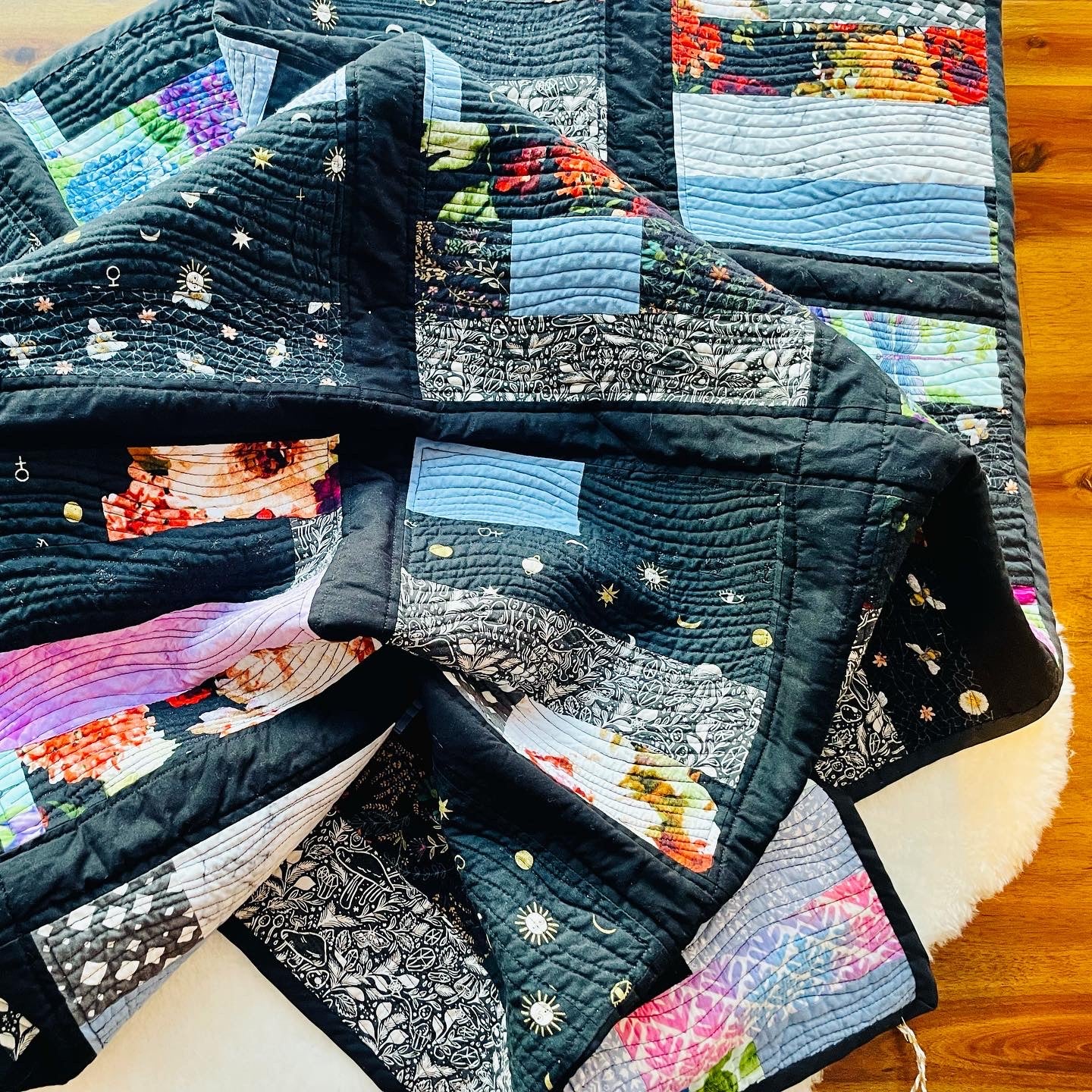 Quilt in Black, Blue, Violet and Grey.