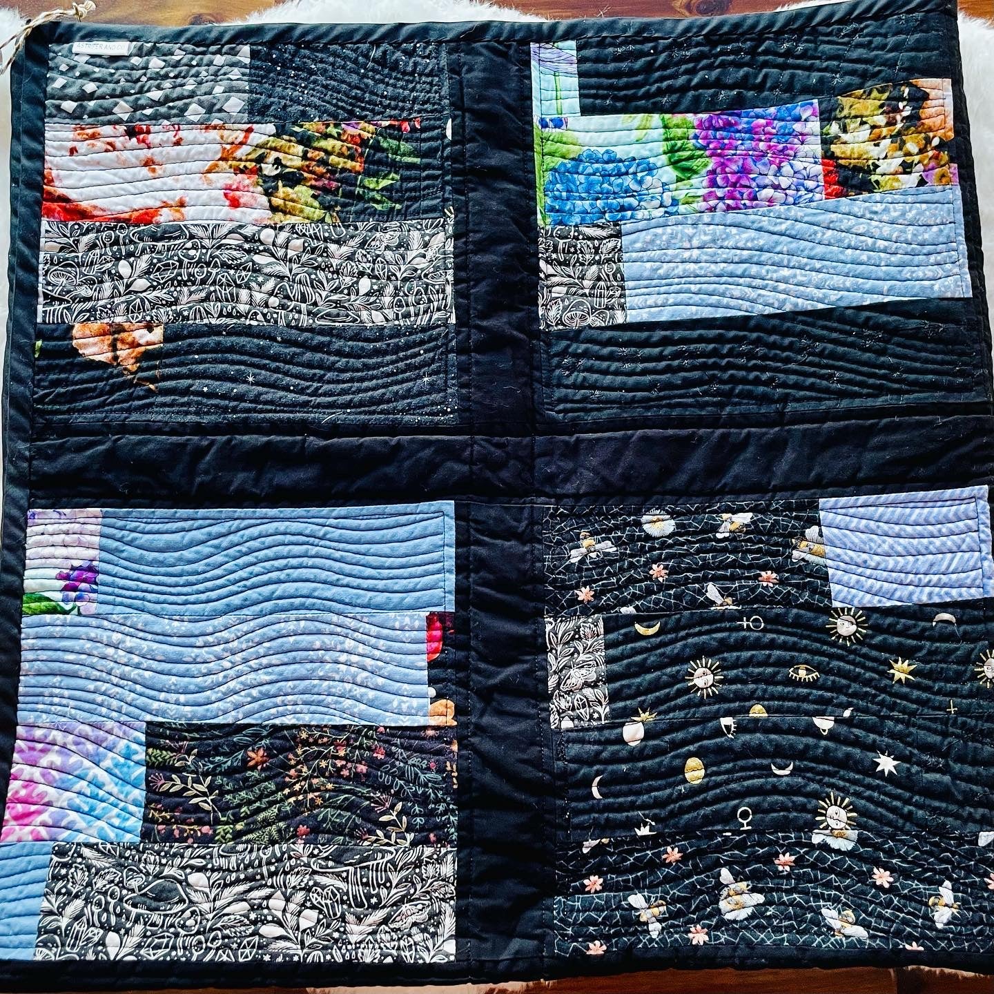 Quilt in Black, Blue, Violet and Grey.